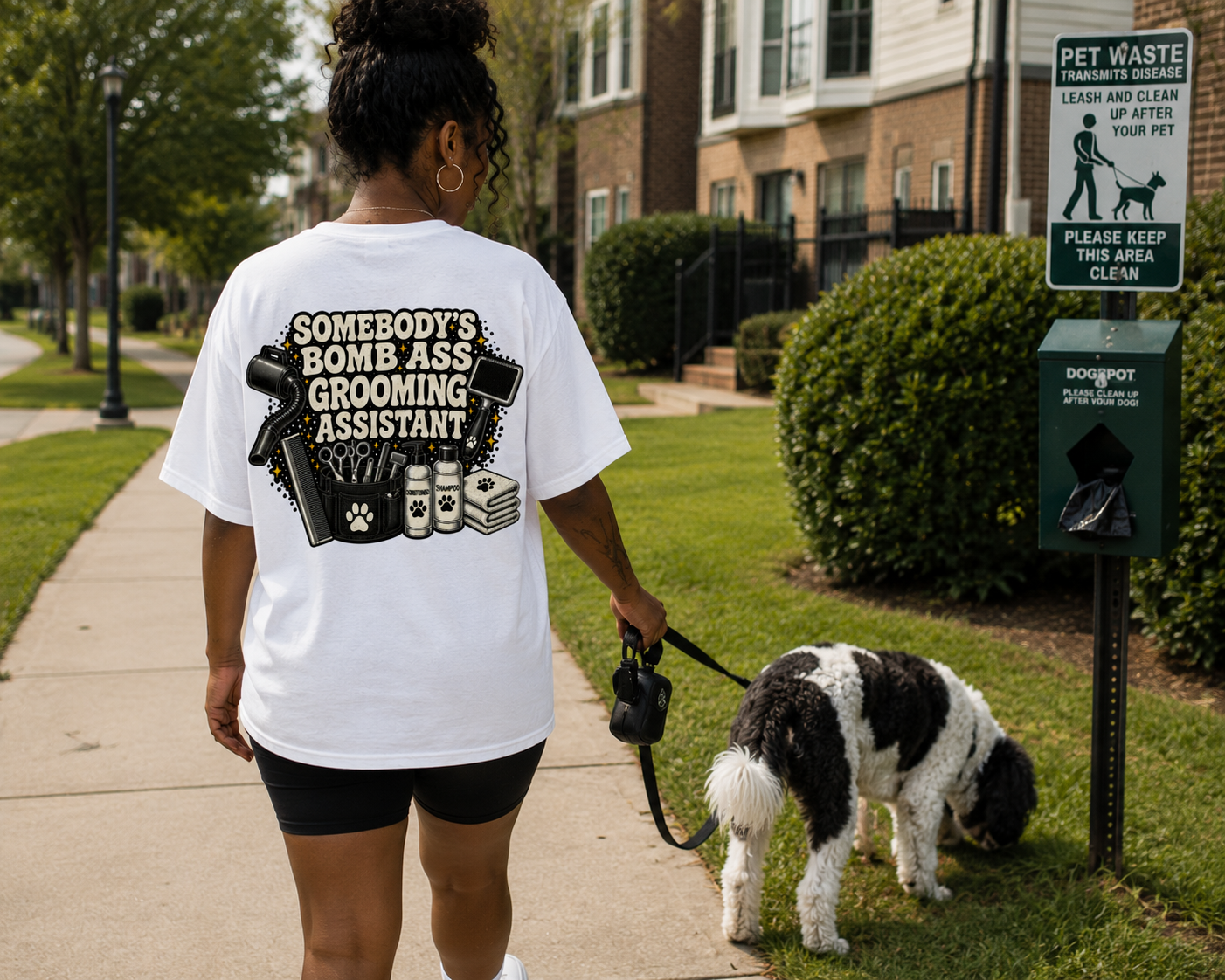 SOMEBODY'S BOMB ASS GROOMING ASSISTANT T-SHIRT