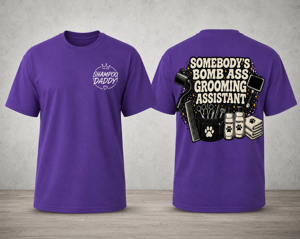 SOMEBODY'S BOMB ASS GROOMING ASSISTANT T-SHIRT